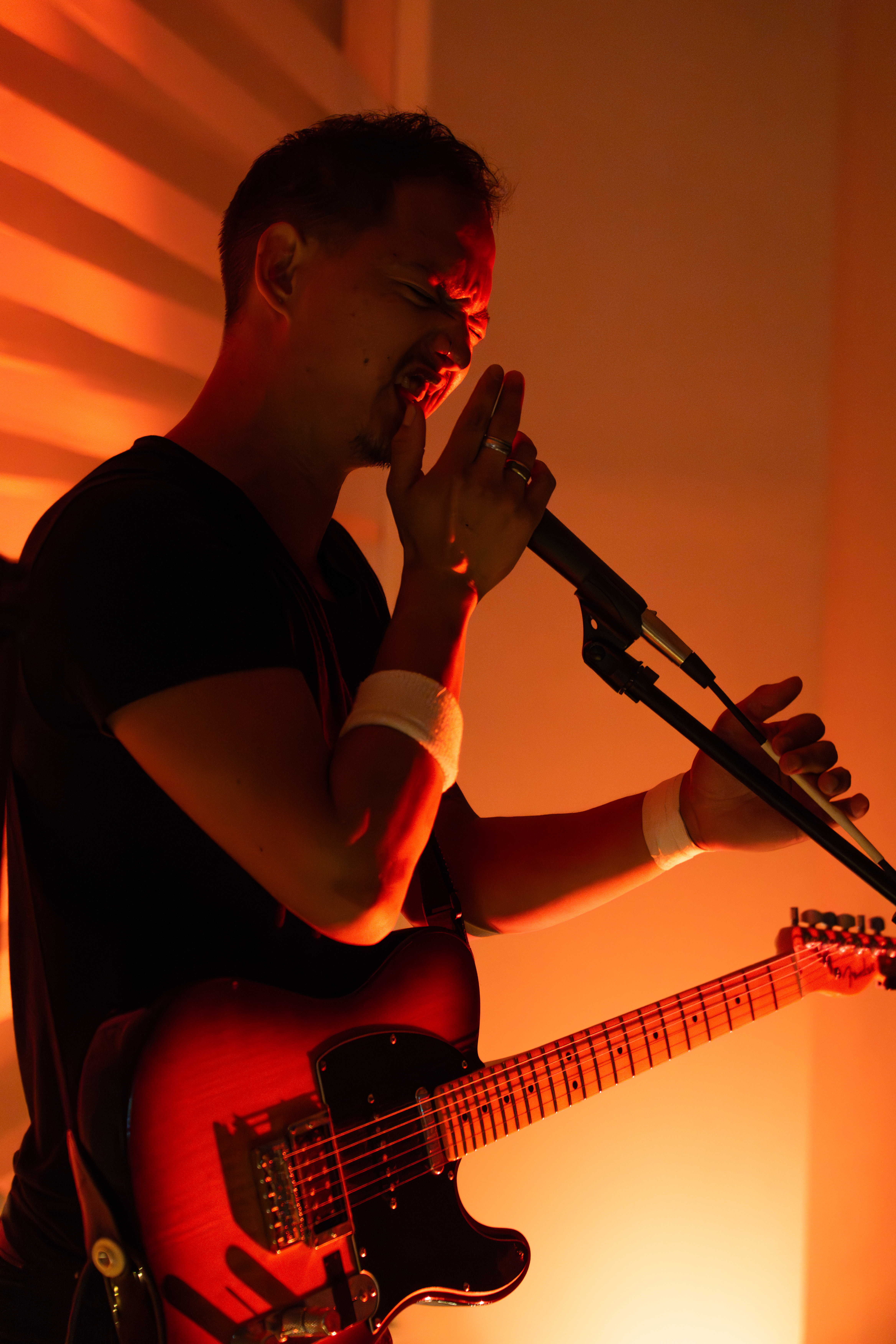 Man passionately into microphone